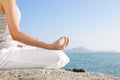 Young woman meditation in yoga pose on the tropical beach Royalty Free Stock Photo