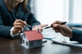 Young woman meeting with a banker for a home loan, Real Estate concept. Approved mortgage application form, concerning mortgage Royalty Free Stock Photo