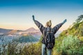 Young woman meets the sunrise at the Bromo Tengger Semeru National Park on the Java Island, Indonesia. She enjoys Royalty Free Stock Photo