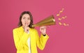 Young woman with megaphone on background