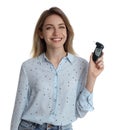 Young woman with modern breathalyzer on white Royalty Free Stock Photo