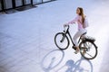 Young woman with modern city electric e-bike clean sustainable urban transportation