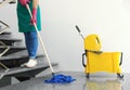 Young woman with mop cleaning Royalty Free Stock Photo