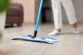 young woman mopping floor at living room Royalty Free Stock Photo