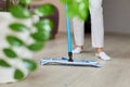 young woman mopping floor at living room Royalty Free Stock Photo