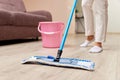 young woman mopping floor at living room Royalty Free Stock Photo