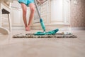 Young Woman Mopping Kitchen Floor Royalty Free Stock Photo