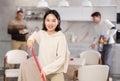 Young woman mopping kitchen floor Royalty Free Stock Photo