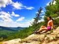 A young woman on the mountain top