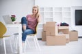 Young woman moving in a new home Royalty Free Stock Photo