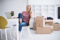 Young woman moving in a new home Royalty Free Stock Photo