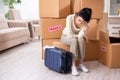 Young woman moving to new flat Royalty Free Stock Photo