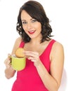 Young Woman with a Mug of Tea and Biscuit Royalty Free Stock Photo