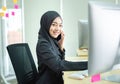 Young woman muslim work in office using phone Royalty Free Stock Photo