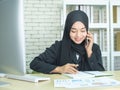 Young woman muslim work in office using phone Royalty Free Stock Photo