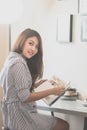 Young woman n her living room reading book Royalty Free Stock Photo