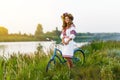 Young woman in national ukrainian folk costume with bicycle Royalty Free Stock Photo