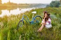 Young woman in national ukrainian folk costume with bicycle Royalty Free Stock Photo