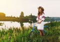 Young woman in national ukrainian folk costume with bicycle Royalty Free Stock Photo