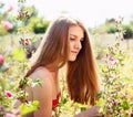 Young woman at nature, surrounding by wild mallows Royalty Free Stock Photo