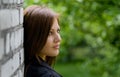 Young Woman Near Brick Wall Royalty Free Stock Photo