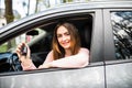 Young woman near the car with keys in hand while buying car Royalty Free Stock Photo