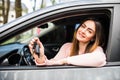 Young woman near the car with keys in hand while buying car Royalty Free Stock Photo