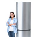 Young woman near closed refrigerator Royalty Free Stock Photo