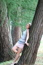 Young woman near trees Royalty Free Stock Photo