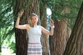 Young woman near trees Royalty Free Stock Photo