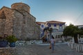 Young Woman Next to Typical Old Church at a Square in a Small Greek Town of Chora in Greece in the Summer, Alonissos Island Part o