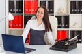 Young woman with notebook and typewriter. Royalty Free Stock Photo