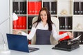 Young woman with notebook and typewriter. Royalty Free Stock Photo