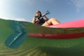 Young woman on ocean in kayak