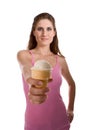 Young woman offering ice cream in waffle cone