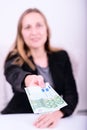 Young woman offering money Royalty Free Stock Photo