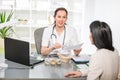 Young woman in an office at the doctor homeopaths. Royalty Free Stock Photo