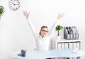 Young woman in the office with hands in the air. Royalty Free Stock Photo