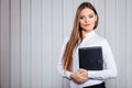 Young woman office worker hold case with files. Royalty Free Stock Photo