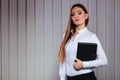 Young woman office worker hold case with files. Royalty Free Stock Photo