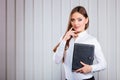 Young woman office worker hold case with files. Royalty Free Stock Photo