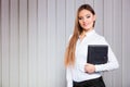 Young woman office worker hold case with files. Royalty Free Stock Photo