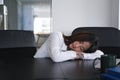 Young woman office worker tired from working and take a nap from depressed work. Royalty Free Stock Photo