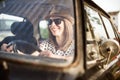 Young woman in old timer car. Royalty Free Stock Photo