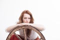 Young woman with an old wagon wheel Royalty Free Stock Photo