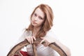 Young woman with an old wagon wheel Royalty Free Stock Photo