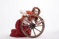 Young woman with an old wagon wheel Royalty Free Stock Photo