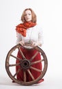 Young woman with an old wagon wheel Royalty Free Stock Photo