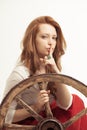 Young woman with an old wagon wheel Royalty Free Stock Photo