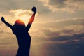 Young woman open arms on sunrise beach Royalty Free Stock Photo